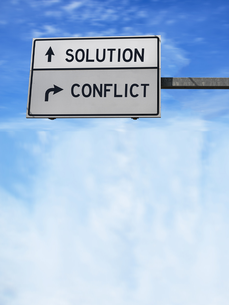 Sign with Solution and Conflict written on it.