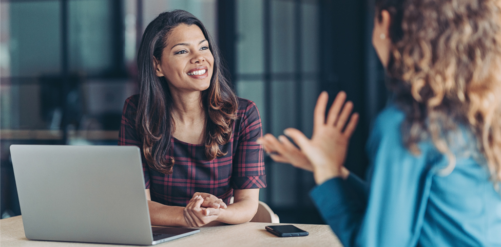 Image of two women having a discussion